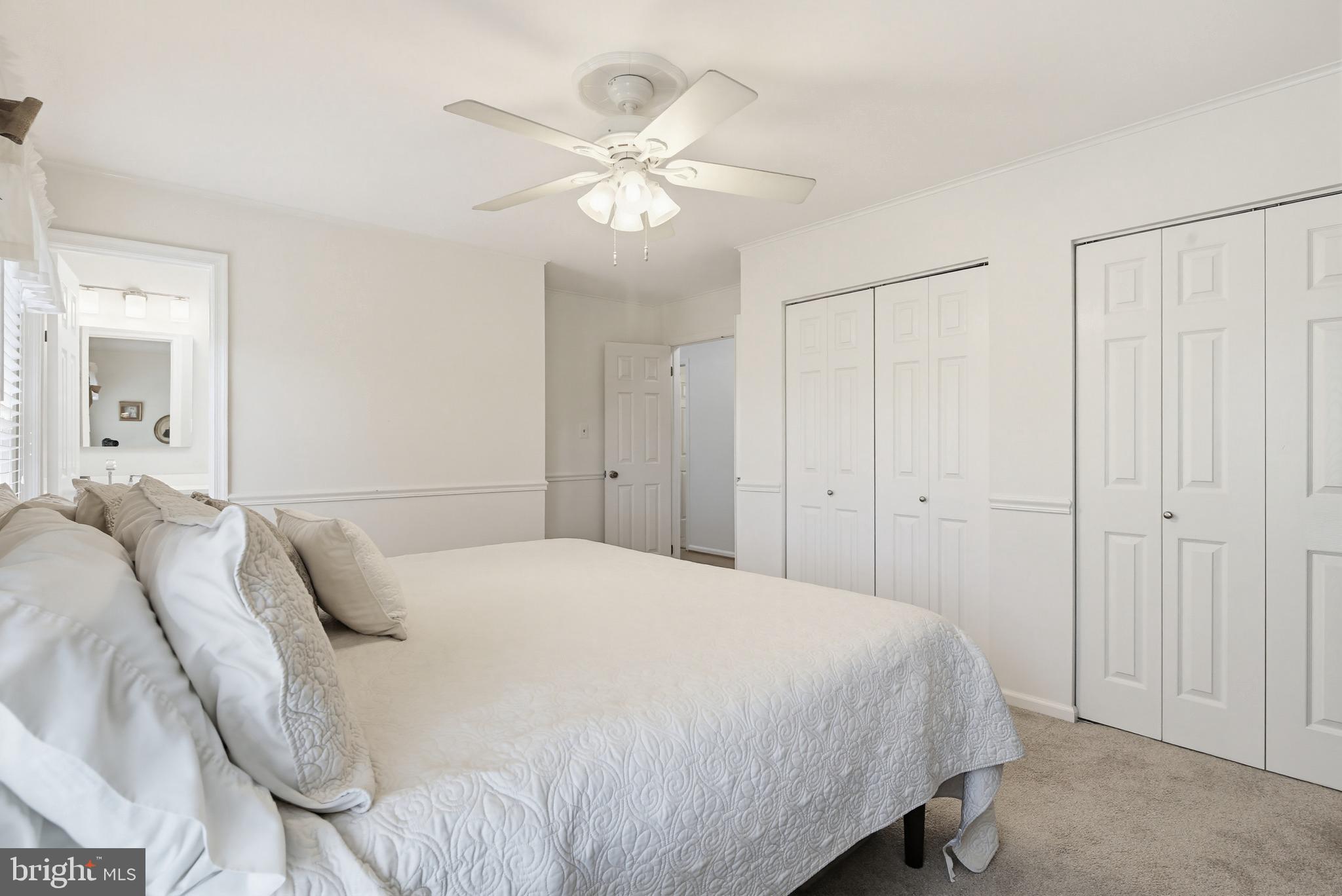 3067 Schubert Drive Silver Spring, MD 20904 - Photo 17 of 41 a bedroom with a bed and a chandelier