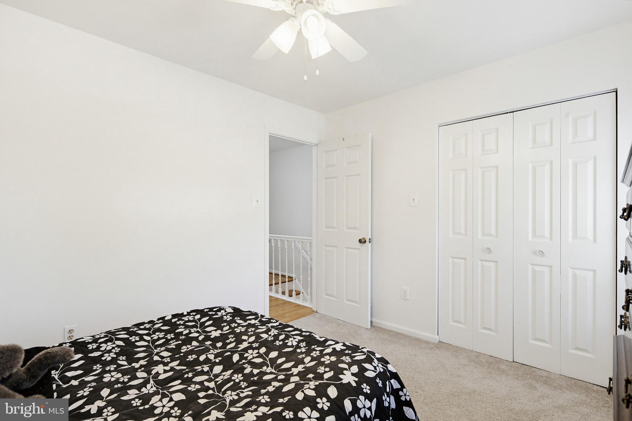 3067 Schubert Drive Silver Spring, MD 20904 - Photo 21 of 41 a bedroom with a bed and a chandelier