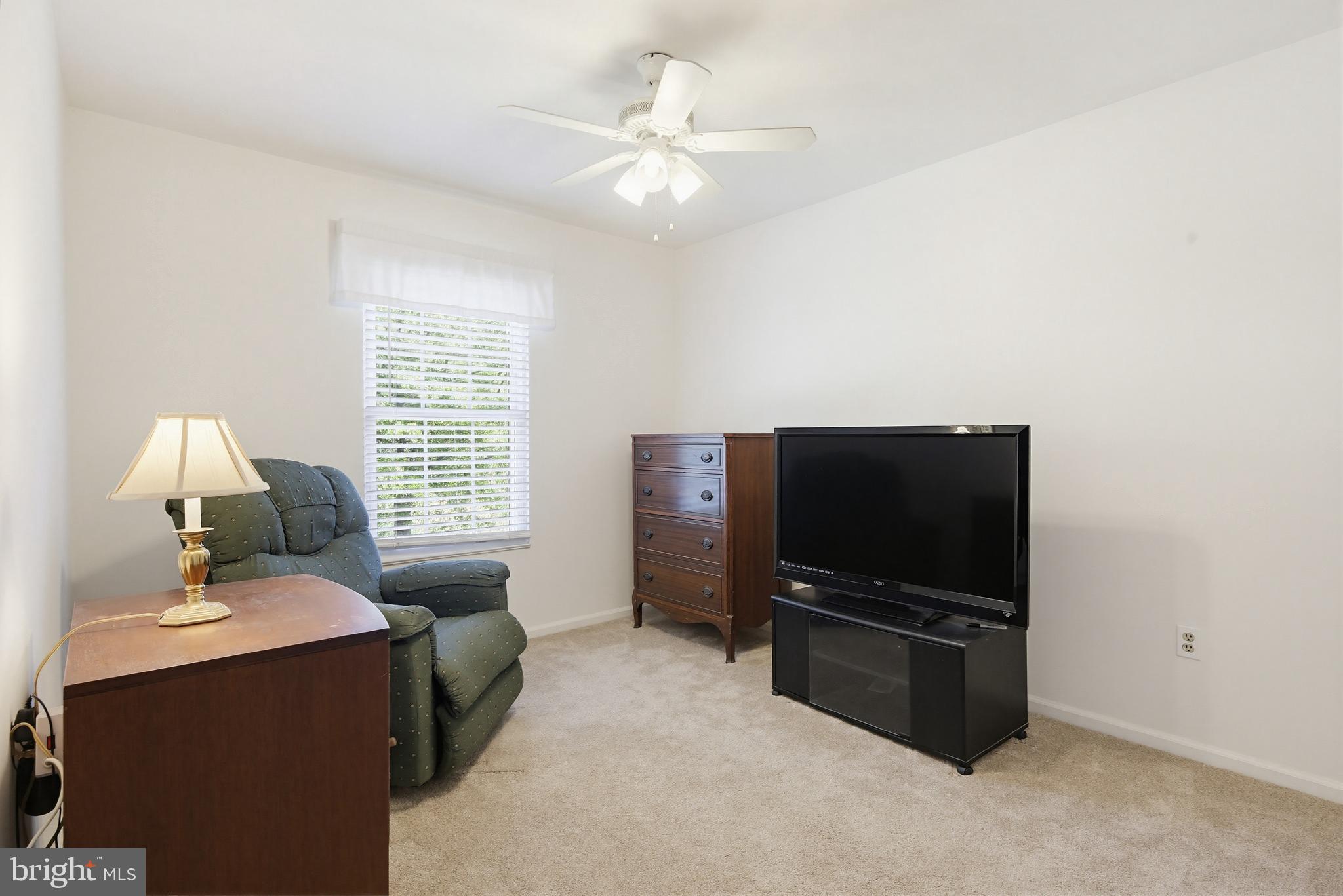 3067 Schubert Drive Silver Spring, MD 20904 - Photo 24 of 41 a living room with furniture and a flat screen tv