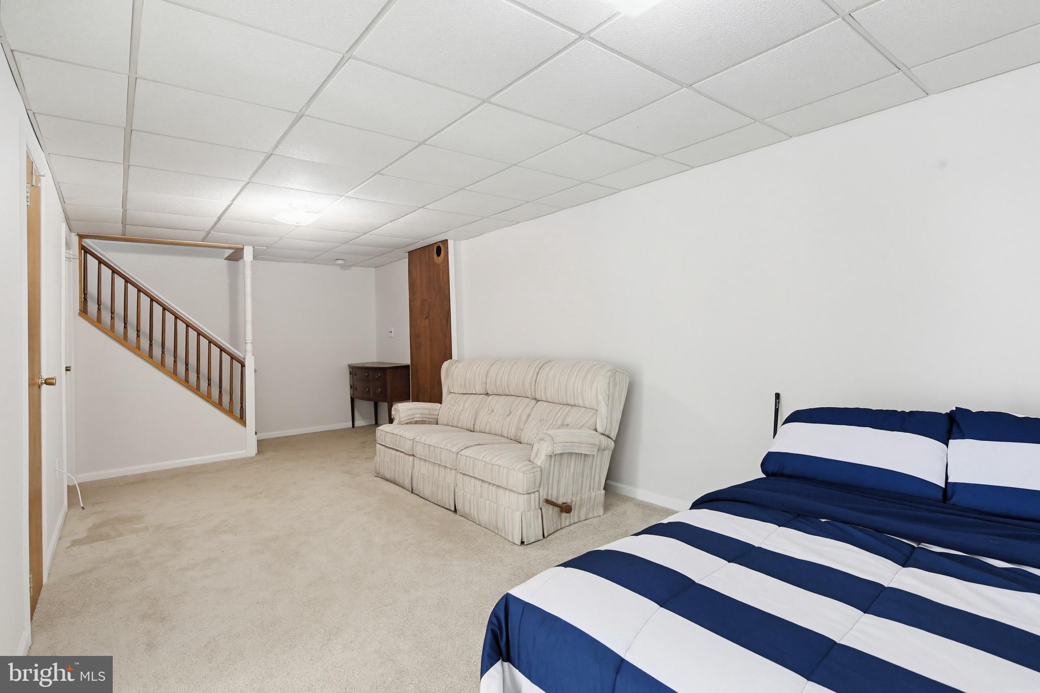 3067 Schubert Drive Silver Spring, MD 20904 - Photo 29 of 41 a bedroom with furniture and a lamp