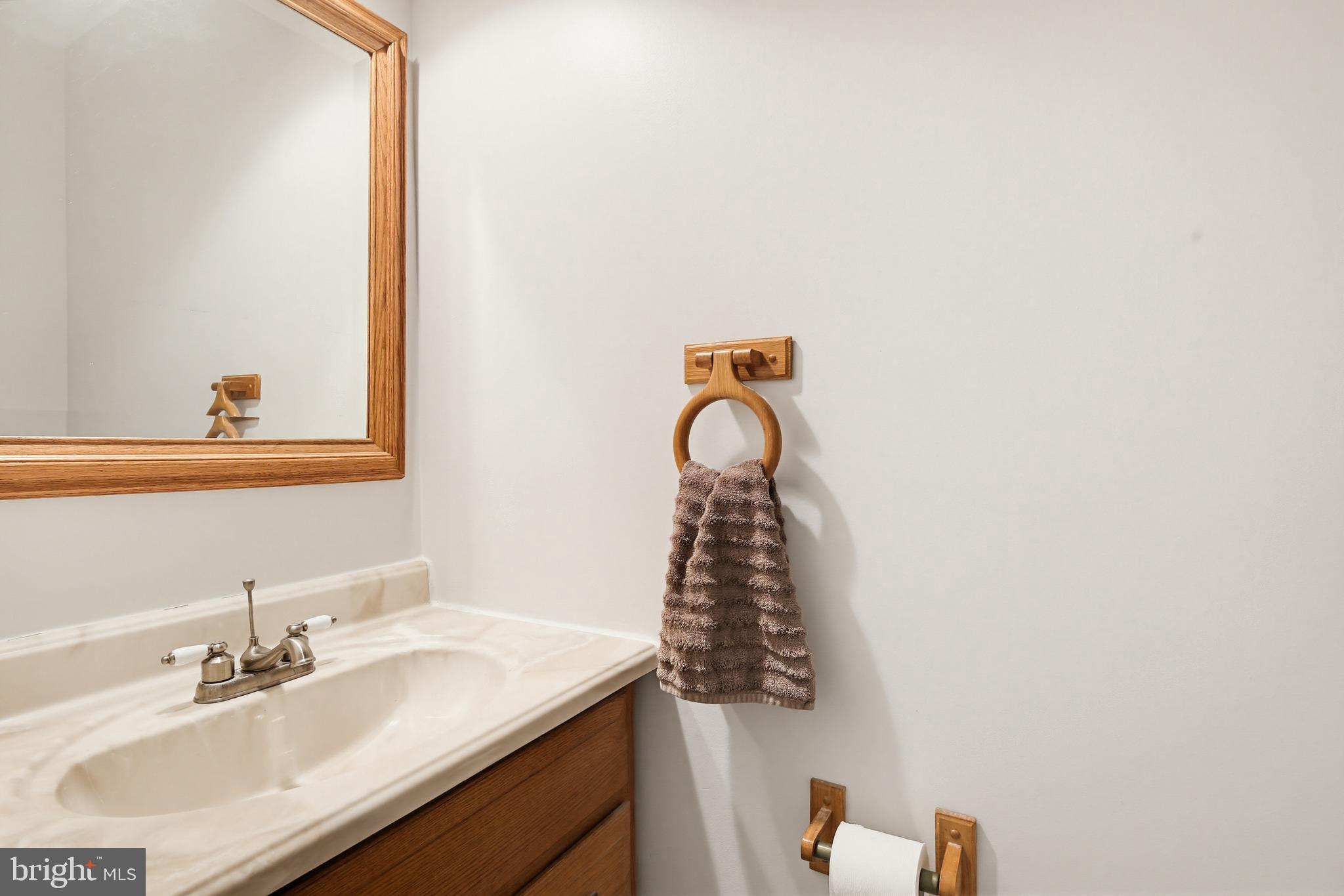 3067 Schubert Drive Silver Spring, MD 20904 - Photo 38 of 41 a bathroom with a sink and a mirror