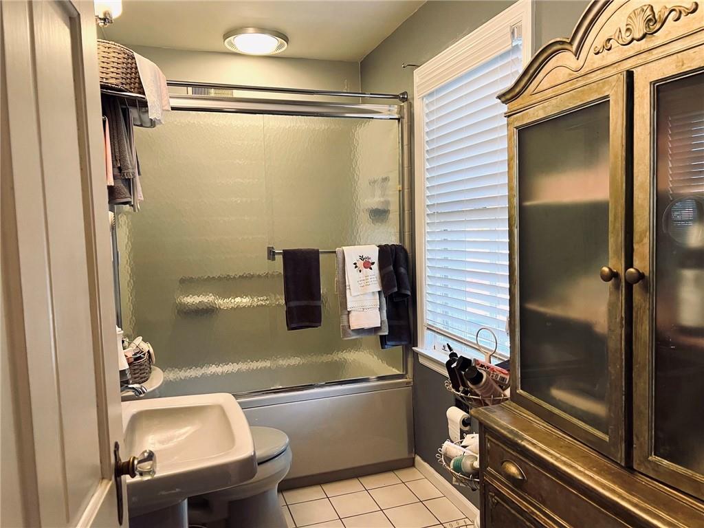 114 Edgewood Road Butler, PA 16001 - Photo 17 of 25 a bathroom with a sink mirror bathtub and toilet