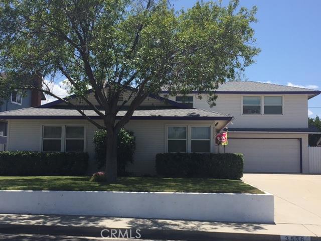 3536 Mapleleaf Drive Riverside, CA 92503 - Photo 1 of 1 a front view of a house with a yard and a garage