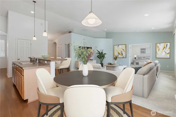 a dining room with furniture and window