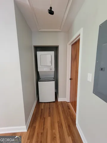 a view of a hallway and wooden floor
