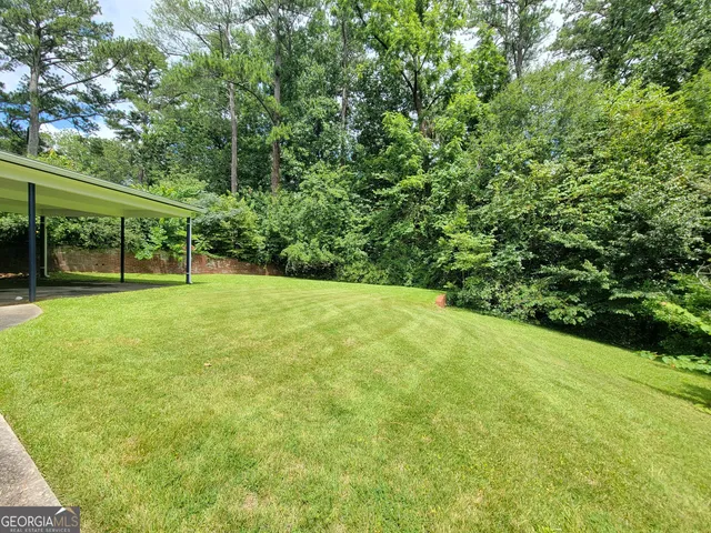a view of outdoor space with deck and garden