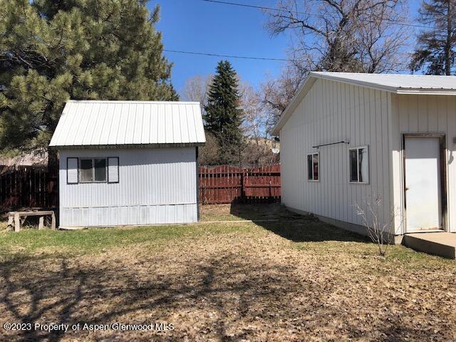 558 Steele Street Craig, CO 81625 - Photo 12 of 52 a view of a house with a yard