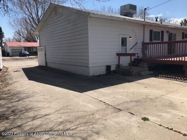 558 Steele Street Craig, CO 81625 - Photo 13 of 52 a view of a house with a yard