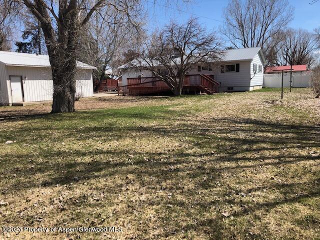 558 Steele Street Craig, CO 81625 - Photo 15 of 52 a view of a house with a yard