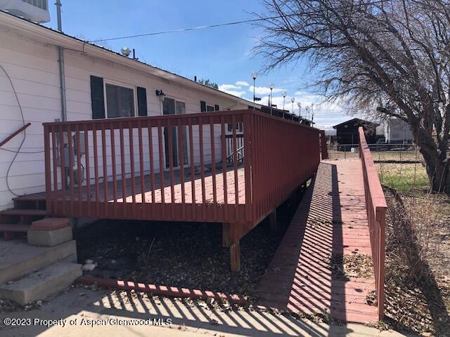 558 Steele Street Craig, CO 81625 - Photo 17 of 52 a view of a balcony with wooden floor