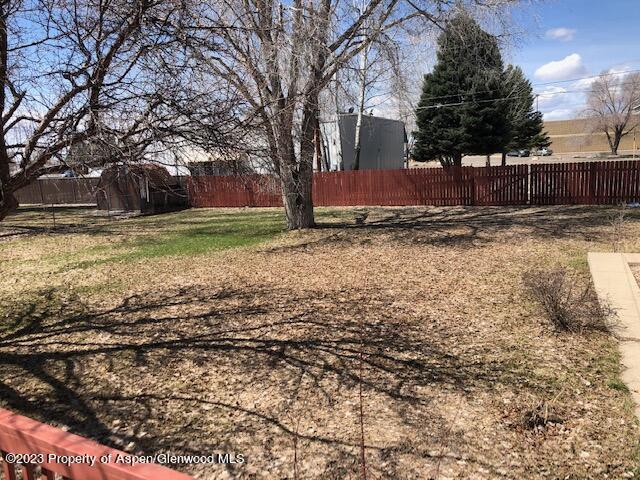 558 Steele Street Craig, CO 81625 - Photo 18 of 52 a view of a yard with wooden fence