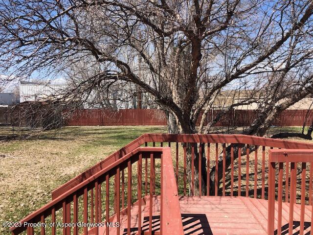 558 Steele Street Craig, CO 81625 - Photo 19 of 52 a view of wooden deck with large trees