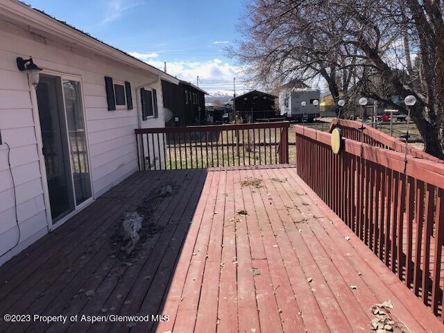 558 Steele Street Craig, CO 81625 - Photo 20 of 52 a balcony with wooden floor and fence