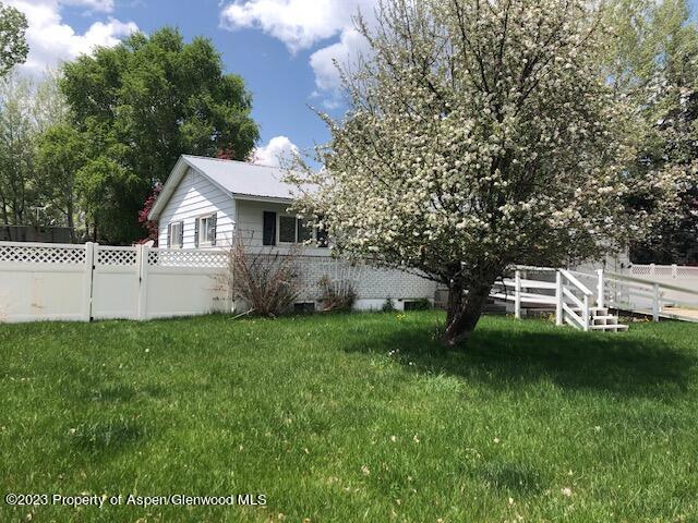 558 Steele Street Craig, CO 81625 - Photo 2 of 52 a view of a house with a backyard