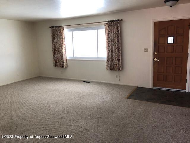 558 Steele Street Craig, CO 81625 - Photo 24 of 52 an empty room with windows