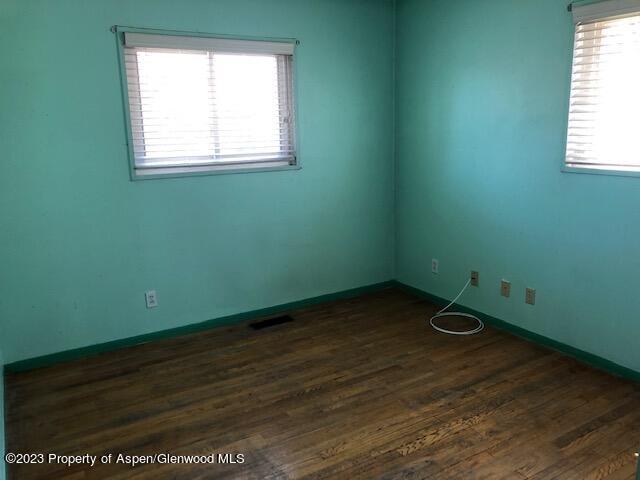558 Steele Street Craig, CO 81625 - Photo 36 of 52 a view of a room with wooden floor and a window
