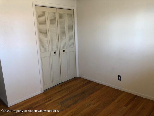 558 Steele Street Craig, CO 81625 - Photo 39 of 52 a view of an empty room with wooden floor