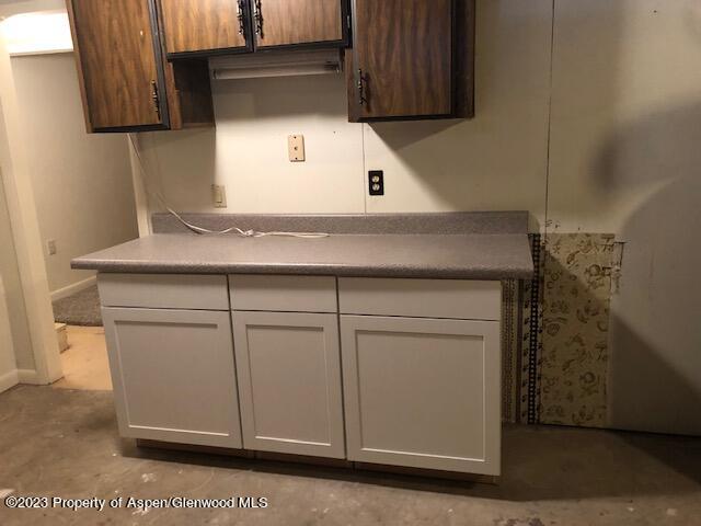 558 Steele Street Craig, CO 81625 - Photo 50 of 52 a kitchen with white cabinets and sink