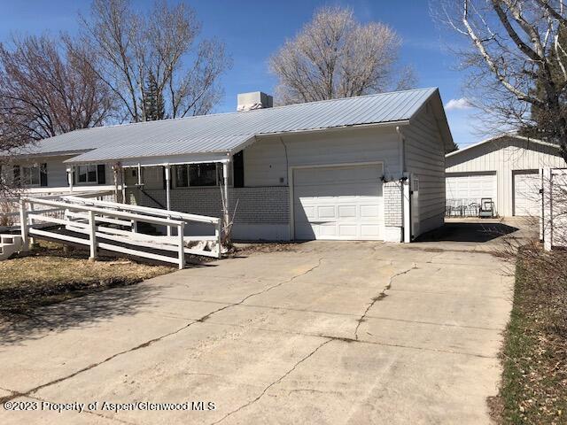 558 Steele Street Craig, CO 81625 - Photo 5 of 52 a view of a house with a yard