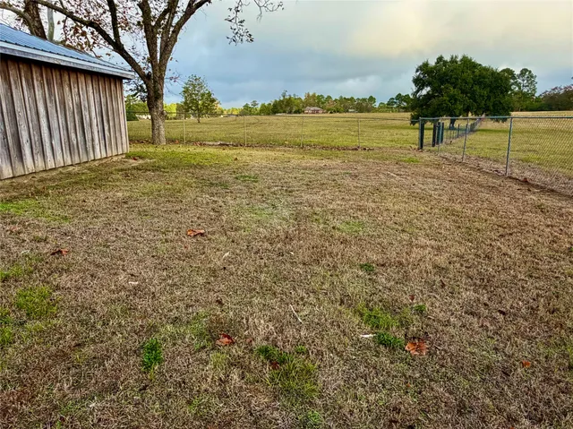 a view of a yard with an trees