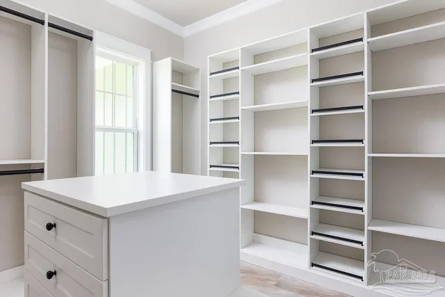 a room with cabinets and a window