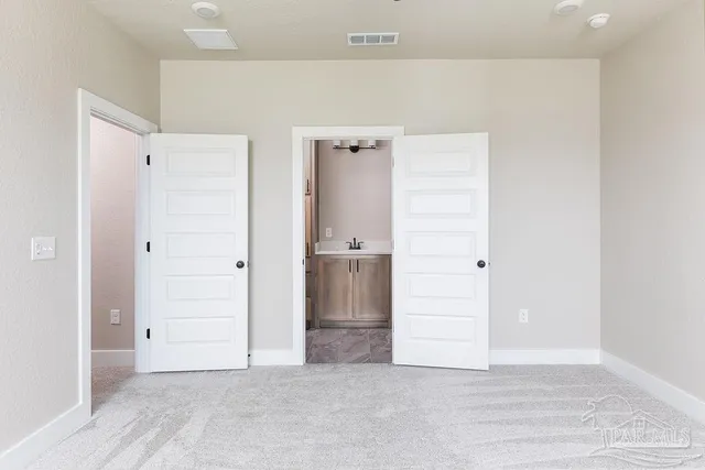 an empty room with an entryway door