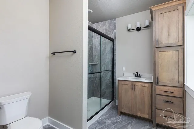 a bathroom with a tub toilet and a sink