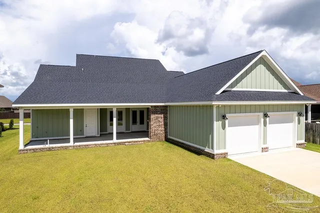 a front view of a house with yard