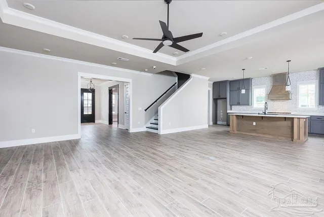 a view of kitchen and wooden floor