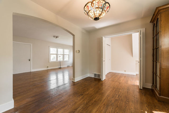645 Normal Road DeKalb, IL 60115 - Photo 5 of 24 an empty room with wooden floor and windows