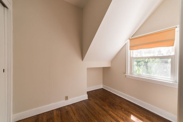645 Normal Road DeKalb, IL 60115 - Photo 6 of 24 an empty room with wooden floor and windows