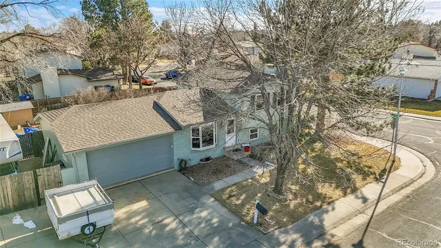 a view of a patio with table and chairs with wooden fence and floor