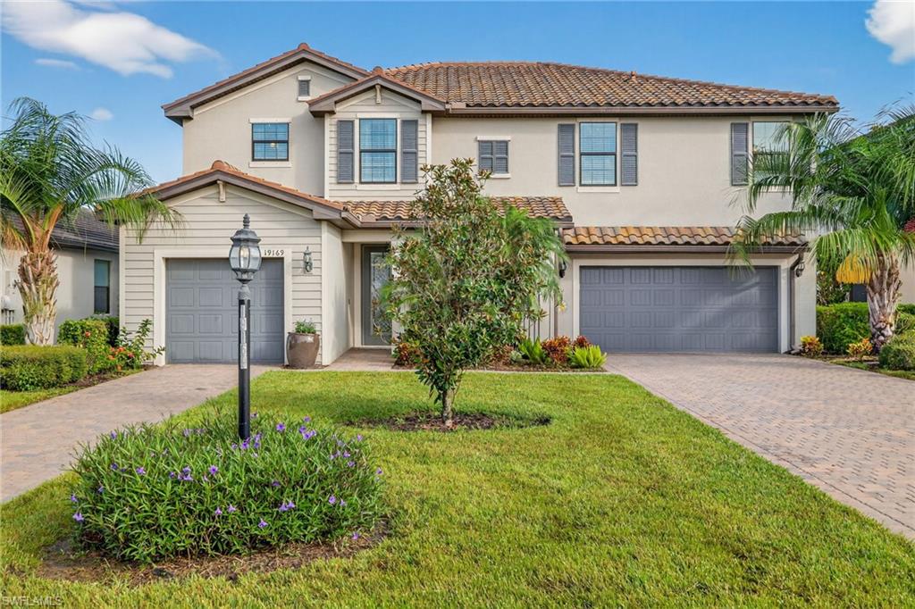 19169 Elston Way Estero, FL 33928 - Photo 1 of 44 a house view with a garden space