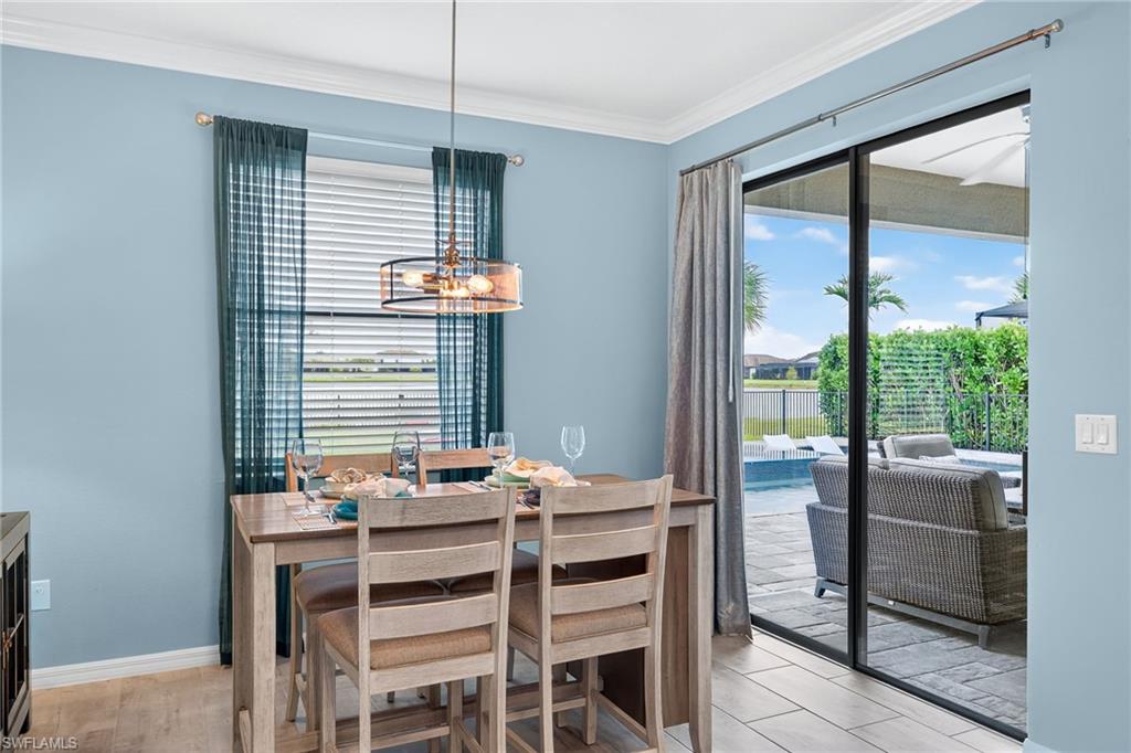 19169 Elston Way Estero, FL 33928 - Photo 13 of 44 a dining room with furniture and window