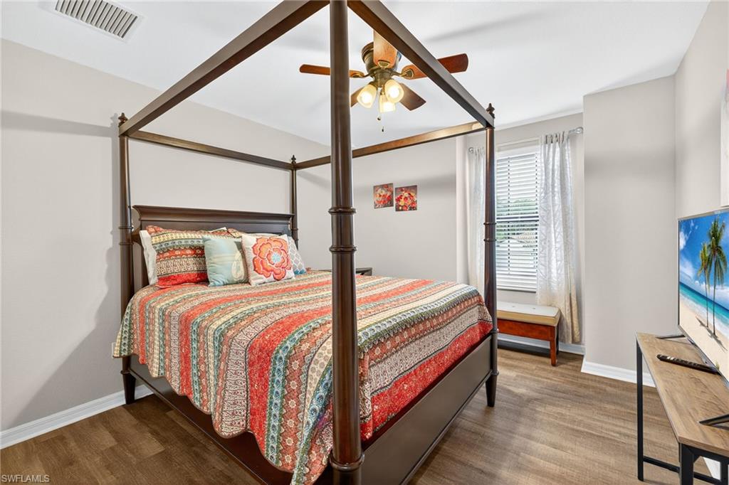 19169 Elston Way Estero, FL 33928 - Photo 19 of 44 a bedroom with a bed and a window