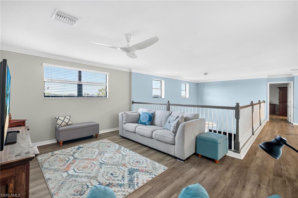 19169 Elston Way Estero, FL 33928 - Photo 23 of 44 a living room with furniture and wooden floor