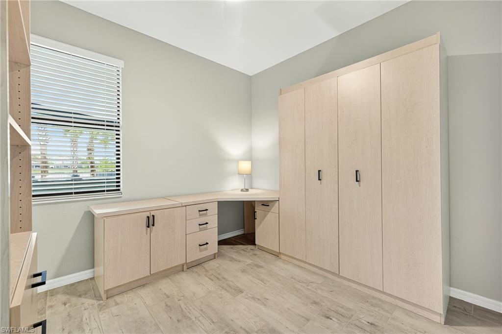 19169 Elston Way Estero, FL 33928 - Photo 25 of 44 a spacious bathroom with a granite countertop sink and a bathtub