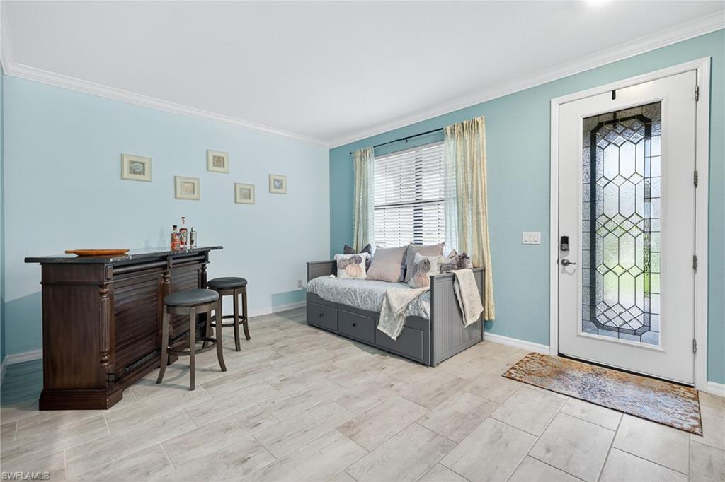 19169 Elston Way Estero, FL 33928 - Photo 3 of 44 a living room with furniture and a window