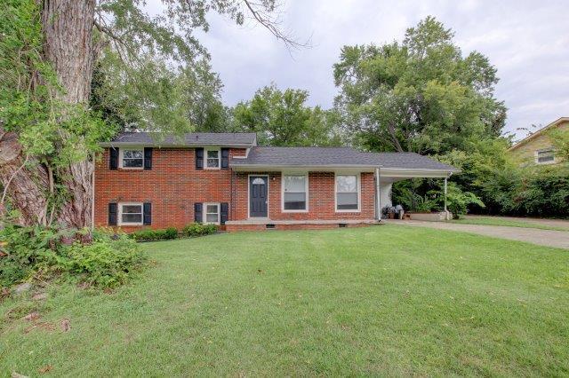 407 Burch Road Clarksville, TN 37042 - Photo 1 of 24 a front view of a house with a garden