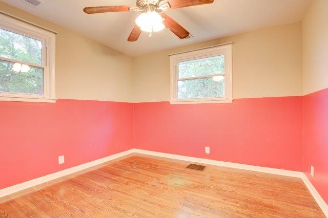 407 Burch Road Clarksville, TN 37042 - Photo 13 of 24 a view of empty room with wooden floor and fan