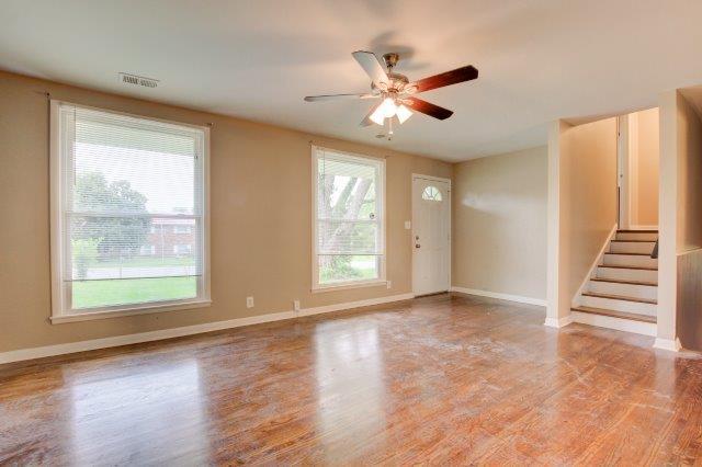 407 Burch Road Clarksville, TN 37042 - Photo 3 of 24 a view of an empty room with wooden floor and a window