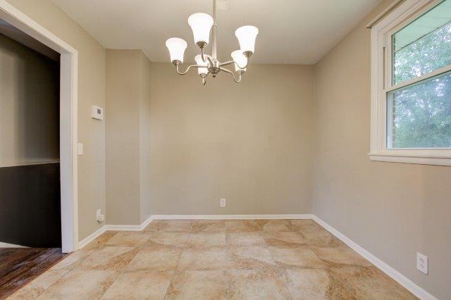 407 Burch Road Clarksville, TN 37042 - Photo 7 of 24 wooden floor in a empty room with a window