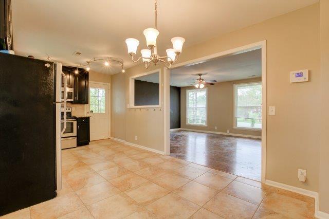 407 Burch Road Clarksville, TN 37042 - Photo 8 of 24 a view of a kitchen with a sink and a refrigerator