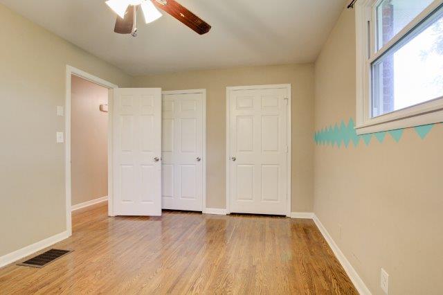 407 Burch Road Clarksville, TN 37042 - Photo 9 of 24 wooden floor in an empty room with a window