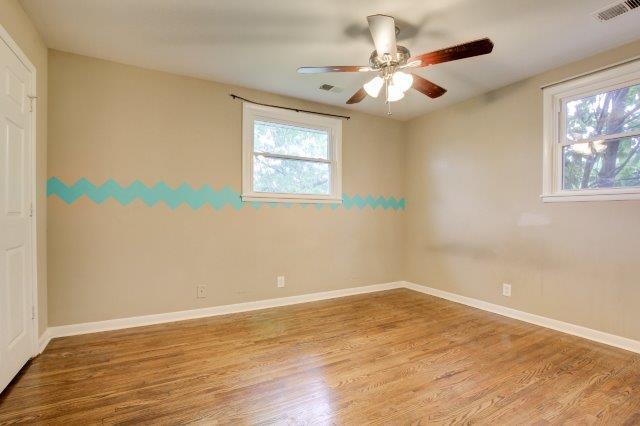 407 Burch Road Clarksville, TN 37042 - Photo 10 of 24 a view of an empty room with wooden floor and a window