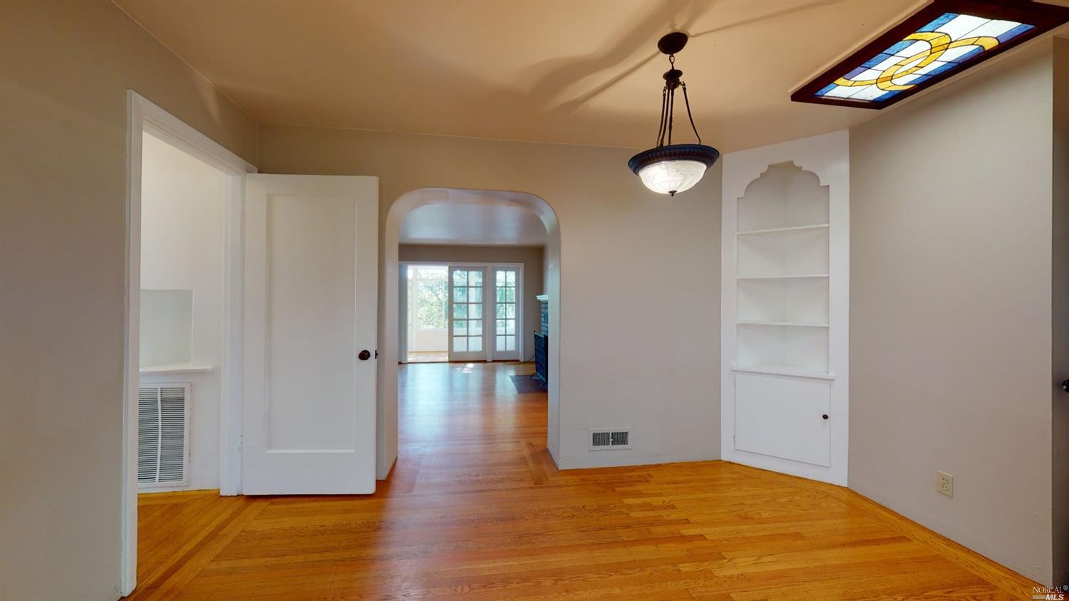 77 Homestead Boulevard Mill Valley, CA 94941 - Photo 16 of 56 a view of an empty room with wooden floor and a window