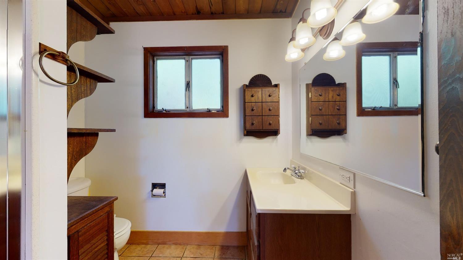 77 Homestead Boulevard Mill Valley, CA 94941 - Photo 23 of 56 a bathroom with a sink and a mirror
