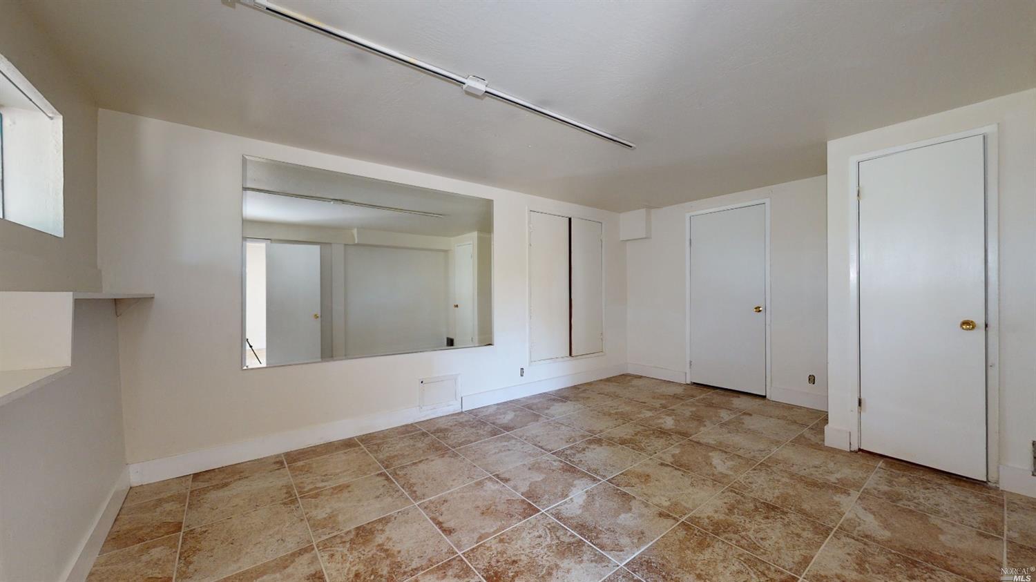 77 Homestead Boulevard Mill Valley, CA 94941 - Photo 4 of 56 a view of an empty room with a window