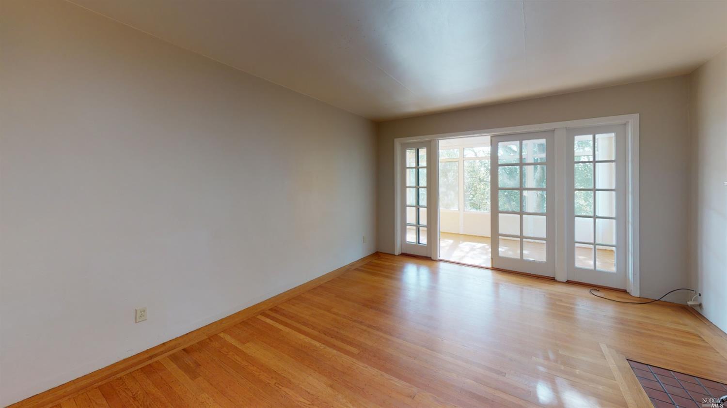 77 Homestead Boulevard Mill Valley, CA 94941 - Photo 43 of 56 wooden floor in an empty room with a window