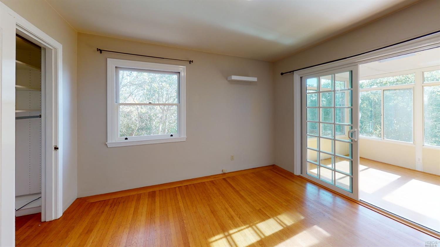 77 Homestead Boulevard Mill Valley, CA 94941 - Photo 46 of 56 a view of empty room with wooden floor and fan